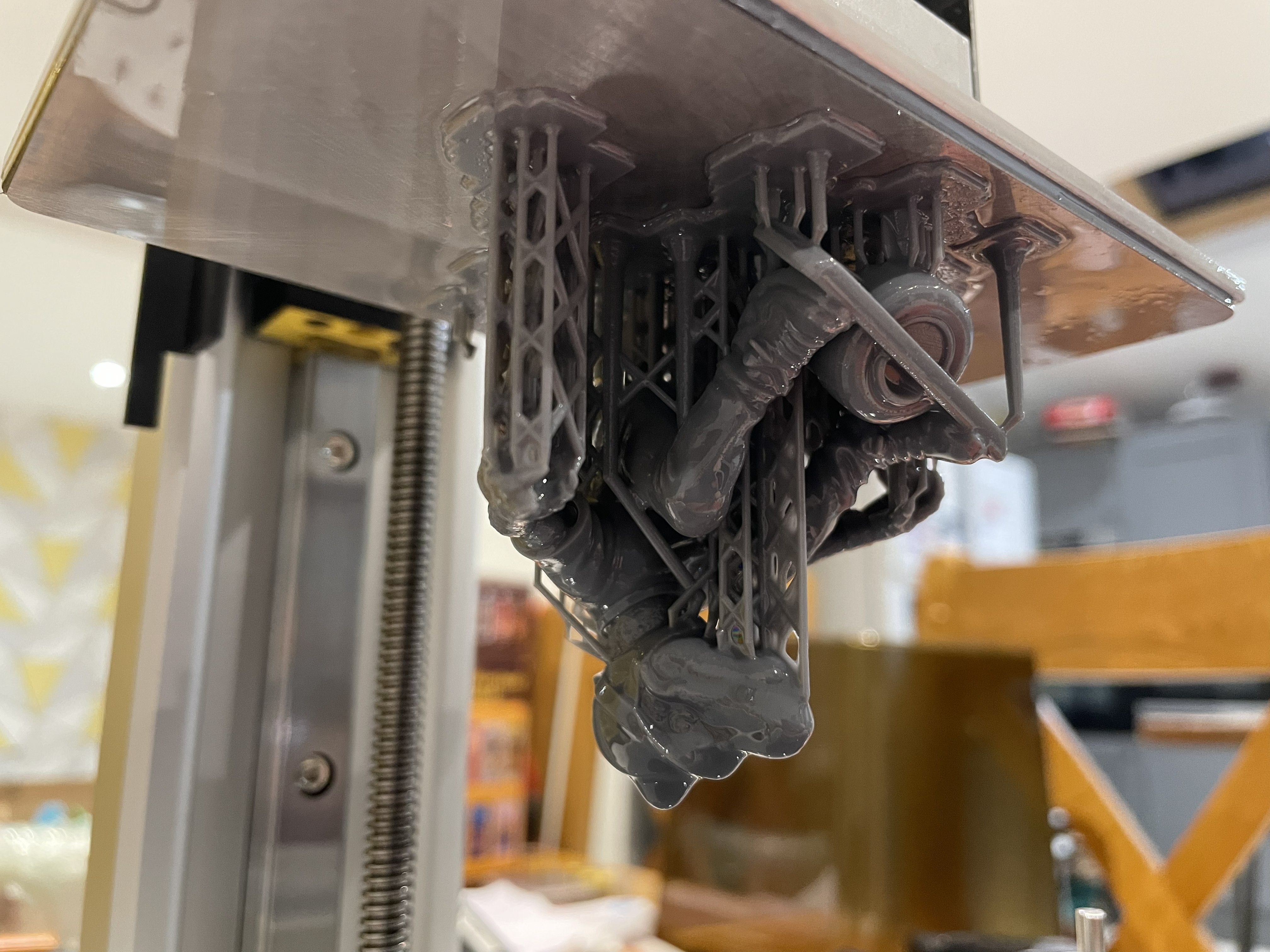 Resin trophy parts on the build plate of a Sonic Fusion 4K Mini